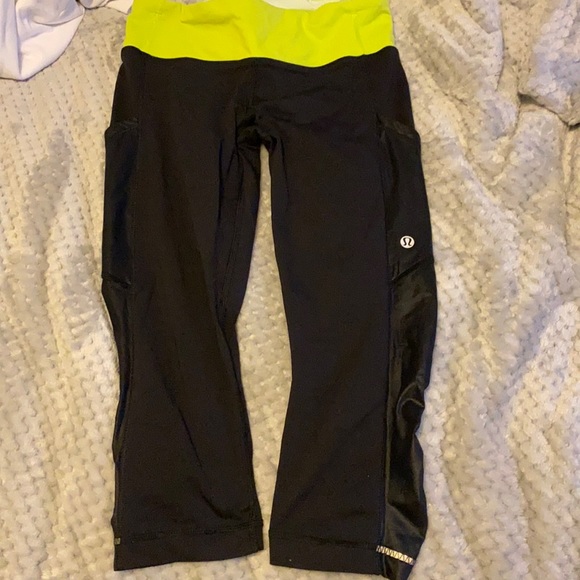 lululemon athletica Pants - Black lululemon capris with green waistband size 4